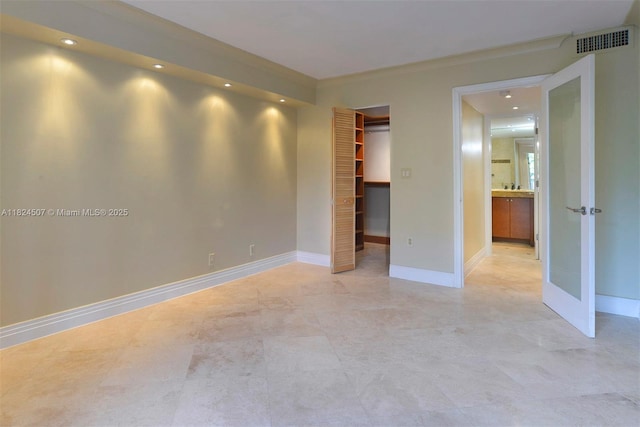 1670 Bay Rd Unit 2D, Miami Beach, FL 33139 - unfurnished bedroom featuring recessed lighting, a spacious closet, french doors, and a closet