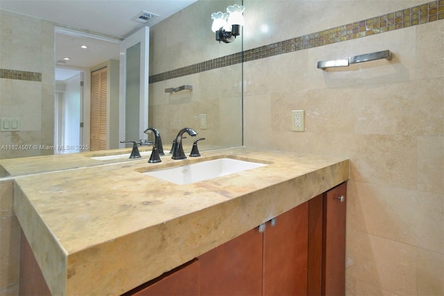 1670 Bay Rd Unit 2D, Miami Beach, FL 33139 - bathroom featuring tile walls and vanity