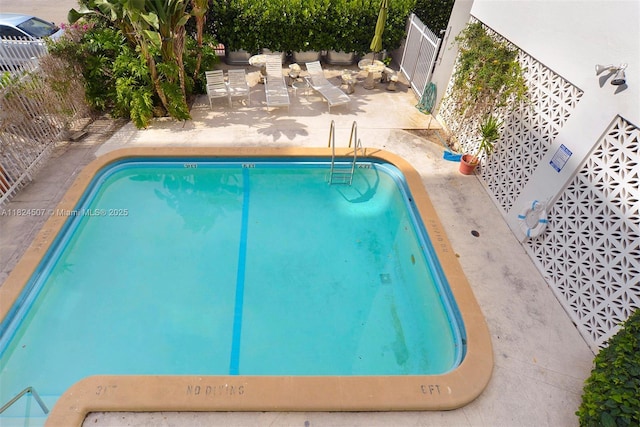 1670 Bay Rd Unit 2D, Miami Beach, FL 33139 - view of swimming pool with a fenced backyard and a patio