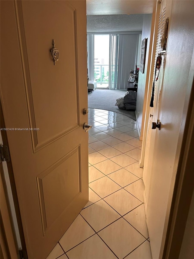 100 Bayview Dr Unit 1030, Sunny Isles Beach, FL 33160 - corridor featuring light tile patterned floors