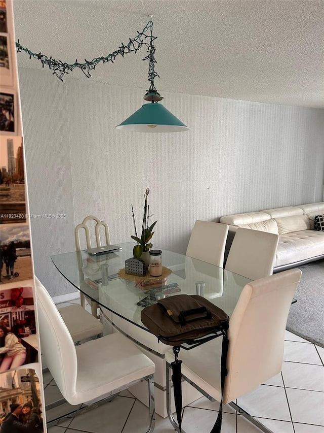 100 Bayview Dr Unit 1030, Sunny Isles Beach, FL 33160 - dining area with a textured ceiling and light tile patterned flooring