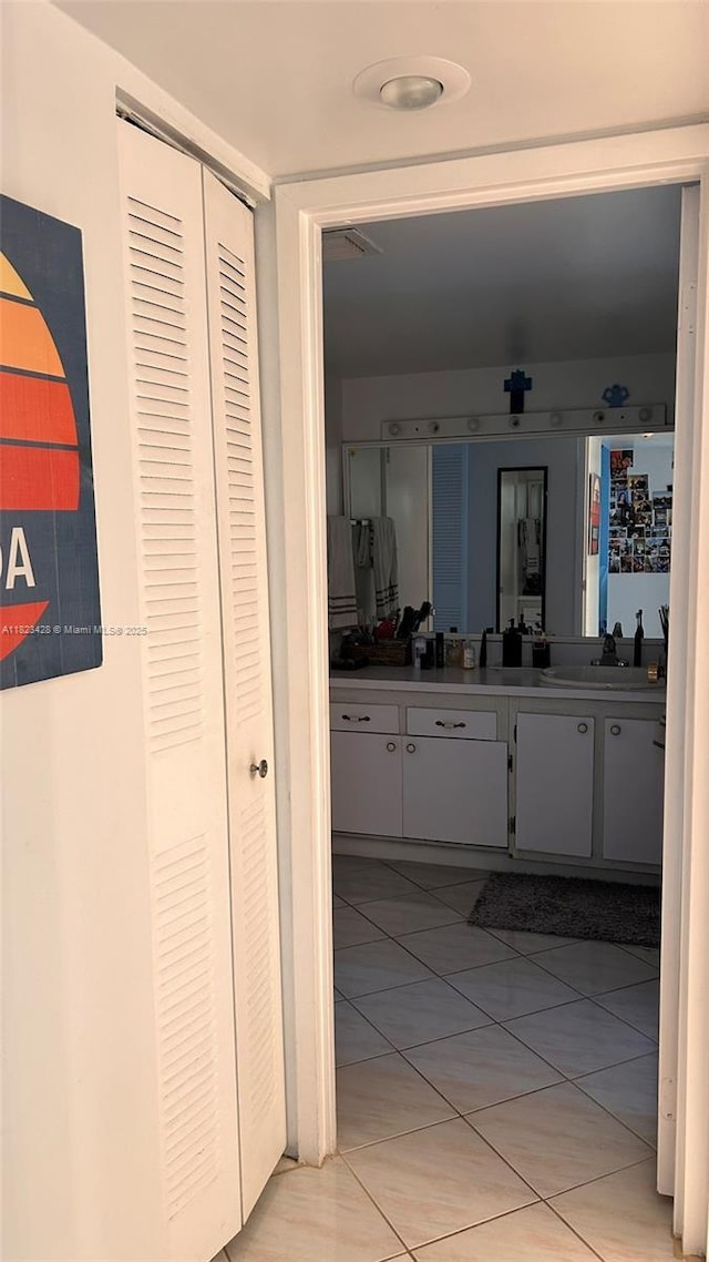 100 Bayview Dr Unit 1030, Sunny Isles Beach, FL 33160 - bathroom with a closet, vanity, and tile patterned flooring