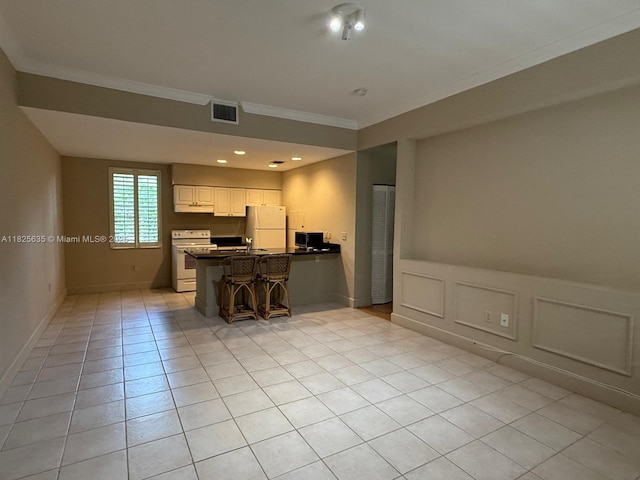 6598 W Sample Rd Unit 6598, Coral Springs, FL 33067 - kitchen featuring white appliances, crown molding, a peninsula, dark countertops, and white cabinets