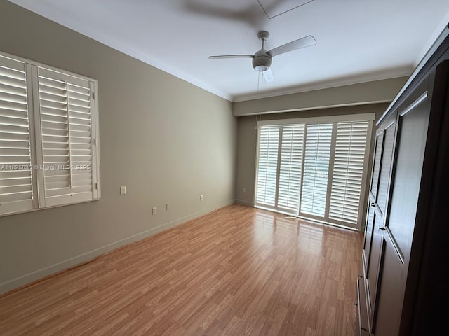6598 W Sample Rd Unit 6598, Coral Springs, FL 33067 - unfurnished bedroom featuring crown molding, light wood-style flooring, and ceiling fan