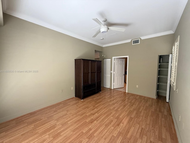6598 W Sample Rd Unit 6598, Coral Springs, FL 33067 - unfurnished bedroom with light wood-style flooring, ornamental molding, and a ceiling fan