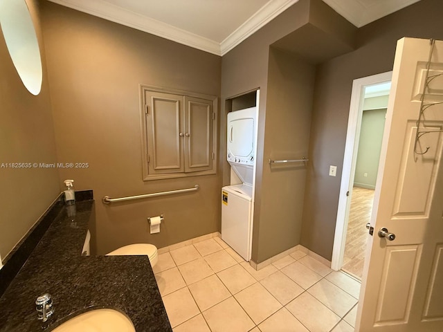 6598 W Sample Rd Unit 6598, Coral Springs, FL 33067 - bathroom with stacked washing machine and dryer, ornamental molding, and tile patterned flooring