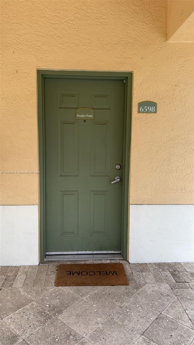 6598 W Sample Rd Unit 6598, Coral Springs, FL 33067 - view of exterior entry with stucco siding