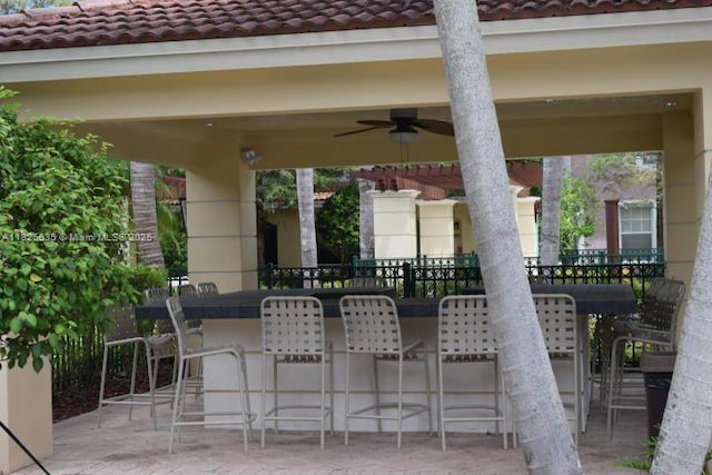 6598 W Sample Rd Unit 6598, Coral Springs, FL 33067 - view of patio featuring a bar and ceiling fan