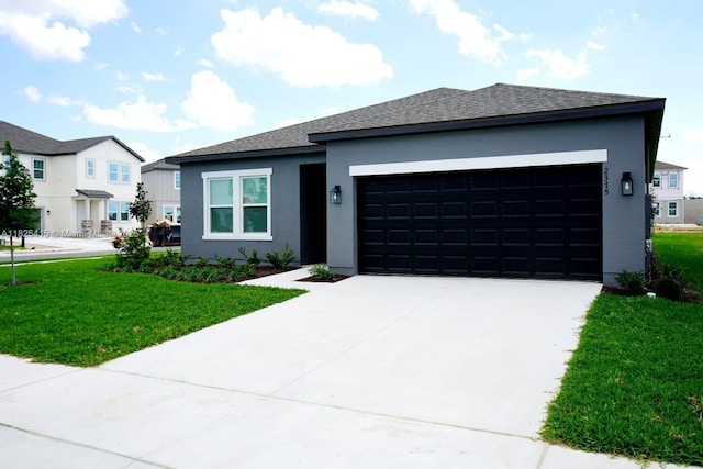2375 Lancashire St, Davenport, FL 33896 - view of front of property with a garage, stucco siding, a front lawn, and concrete driveway