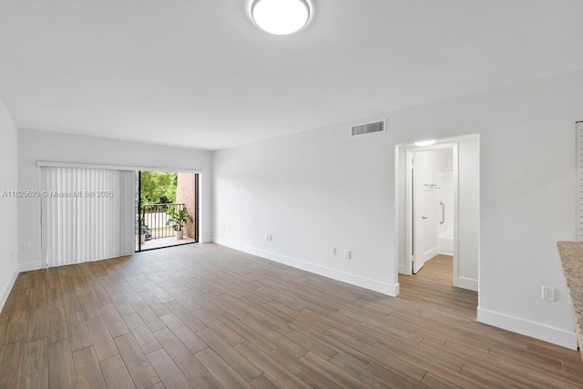 8261 SW 128th St Unit 215, Pinecrest, FL 33156 - empty room featuring wood finished floors and baseboards