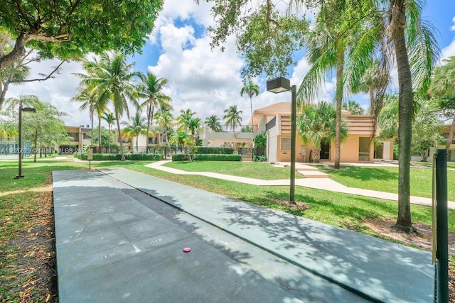 8261 SW 128th St Unit 215, Pinecrest, FL 33156 - view of community featuring shuffleboard and a yard