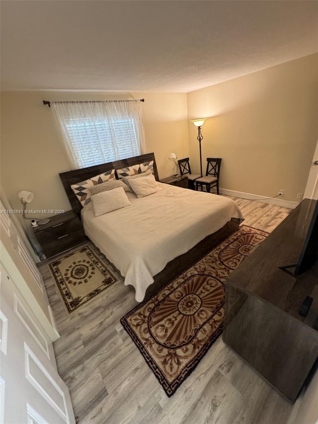 1428 SE 4th Ave Unit 103, Deerfield Beach, FL 33441 - bedroom with wood finished floors and baseboards