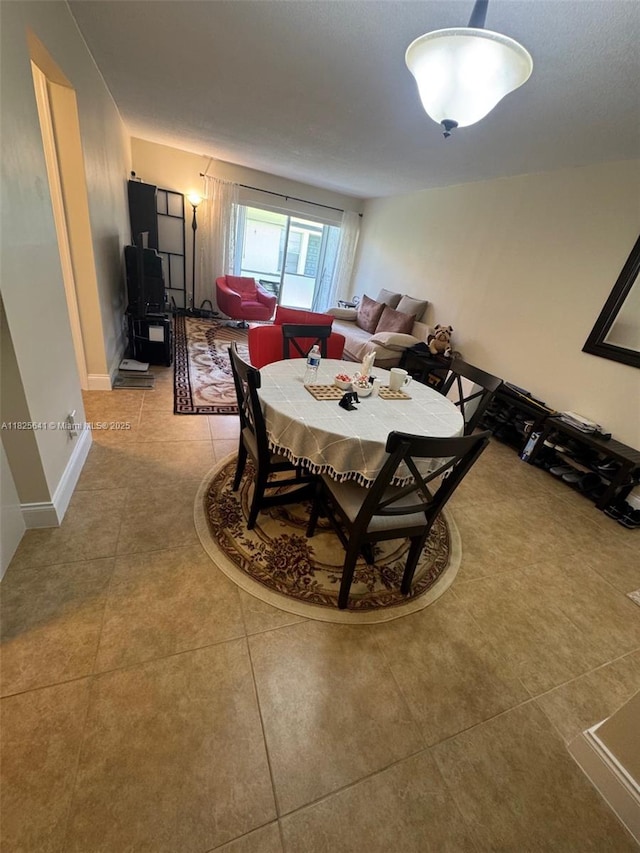 1428 SE 4th Ave Unit 103, Deerfield Beach, FL 33441 - dining space featuring tile patterned flooring
