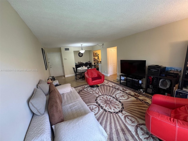 1428 SE 4th Ave Unit 103, Deerfield Beach, FL 33441 - living area with a textured ceiling and baseboards