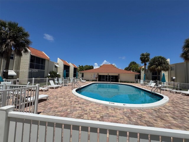1428 SE 4th Ave Unit 103, Deerfield Beach, FL 33441 - community pool with a patio