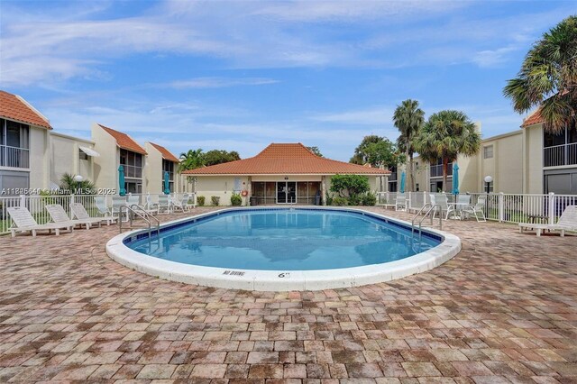 1428 SE 4th Ave Unit 103, Deerfield Beach, FL 33441 - community pool with a patio area