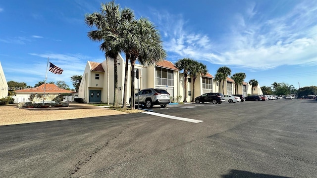 1428 SE 4th Ave Unit 103, Deerfield Beach, FL 33441 - view of property with uncovered parking and a residential view