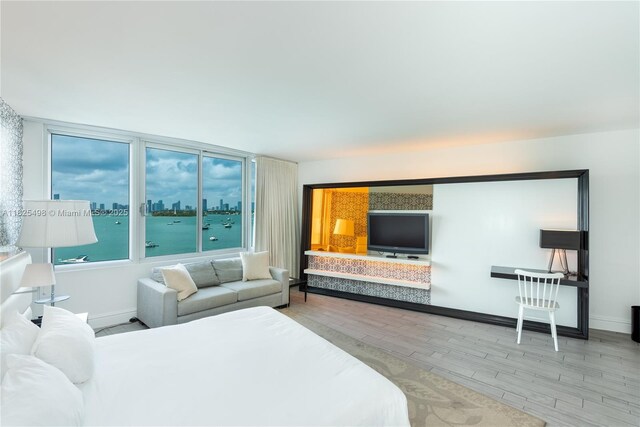 1100 W Ave Unit 506, Miami Beach, FL 33139 - bedroom with wood finished floors and baseboards