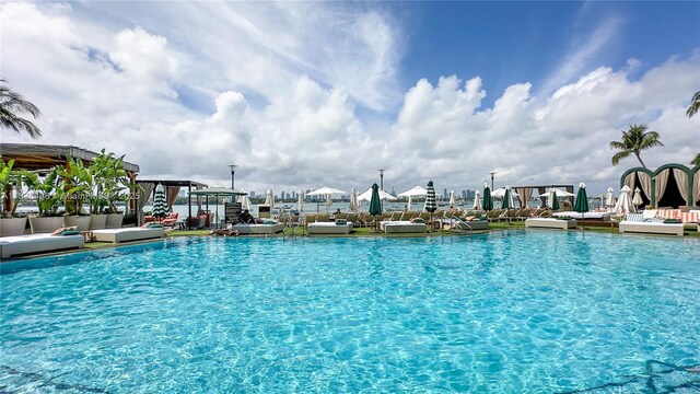 1100 W Ave Unit 506, Miami Beach, FL 33139 - community pool featuring outdoor lounge area