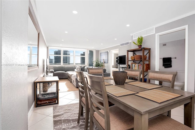 6770 Indian Creek Dr Unit 14C, Miami Beach, FL 33141 - dining area featuring light tile patterned floors, ornamental molding, and recessed lighting