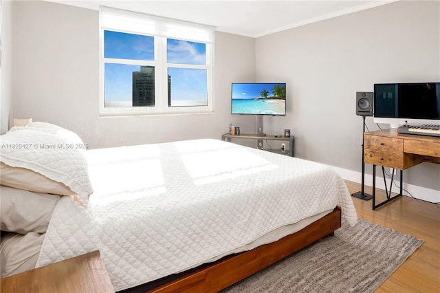 6770 Indian Creek Dr Unit 14C, Miami Beach, FL 33141 - bedroom with wood finished floors and ornamental molding