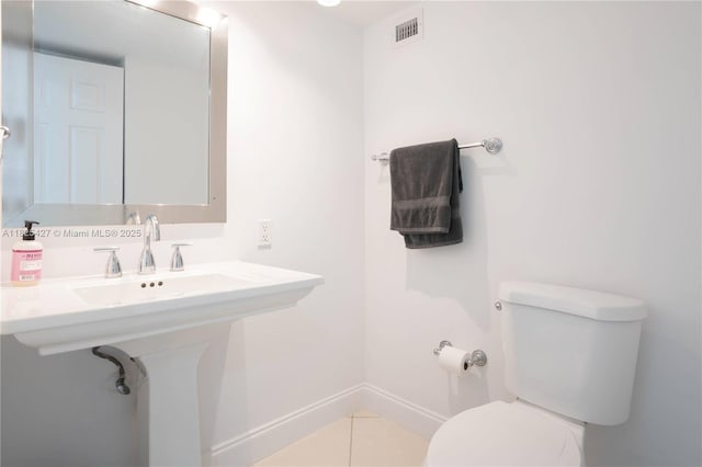 6770 Indian Creek Dr Unit 14C, Miami Beach, FL 33141 - bathroom with toilet and tile patterned floors