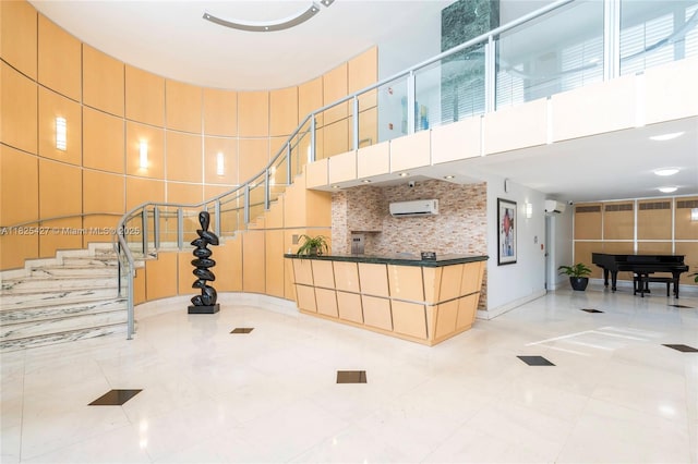 6770 Indian Creek Dr Unit 14C, Miami Beach, FL 33141 - building lobby featuring a high ceiling and stairs