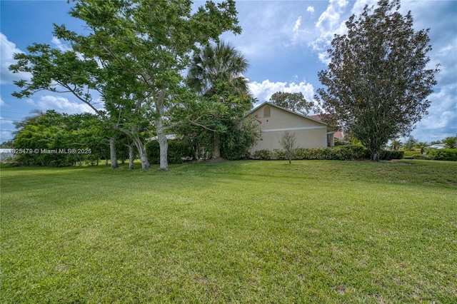 1381 SW Leisure Ln, Port St Lucie, FL 34953 - view of green lawn