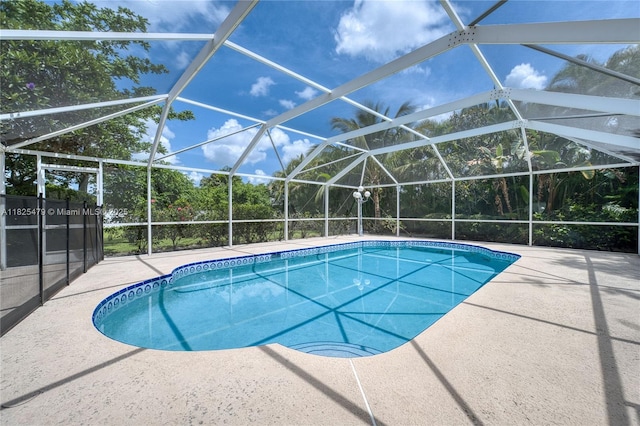 1381 SW Leisure Ln, Port St Lucie, FL 34953 - swimming pool featuring a patio and a lanai