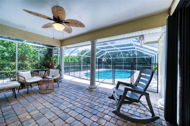 1381 SW Leisure Ln, Port St Lucie, FL 34953 - outdoor pool with a patio area, glass enclosure, and ceiling fan