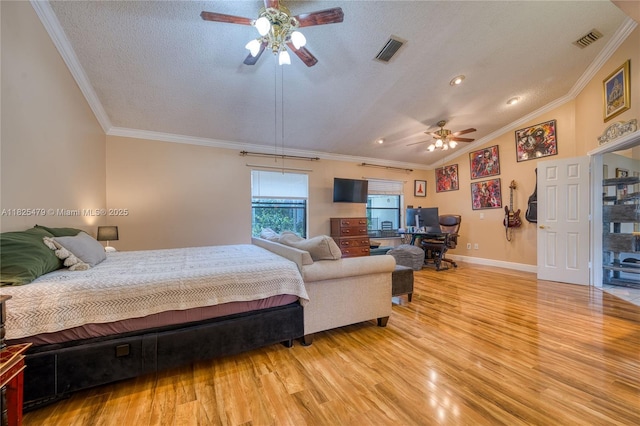 1381 SW Leisure Ln, Port St Lucie, FL 34953 - bedroom with light wood-style flooring, a textured ceiling, crown molding, a desk, and lofted ceiling