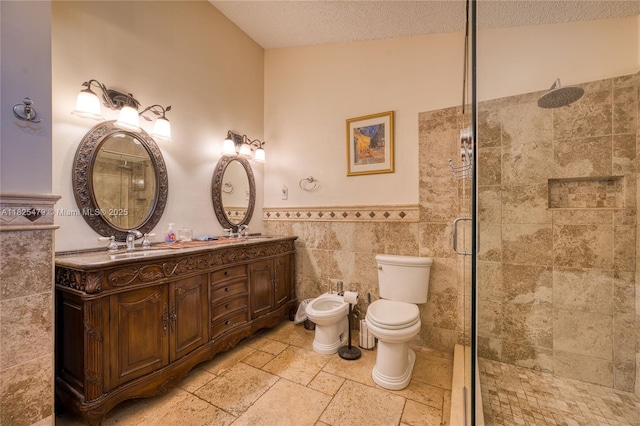 1381 SW Leisure Ln, Port St Lucie, FL 34953 - bathroom featuring a shower stall, tile walls, stone tile flooring, double vanity, and a bidet