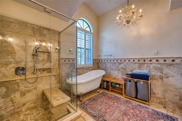 1381 SW Leisure Ln, Port St Lucie, FL 34953 - full bath with tile walls, a shower stall, a freestanding bath, healthy amount of natural light, and wainscoting