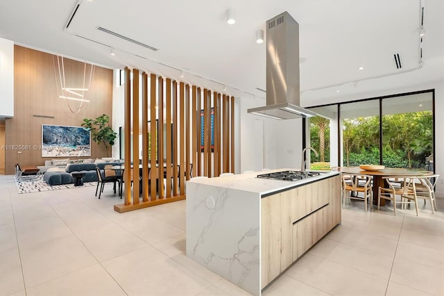 7660 SW 124th St, Pinecrest, FL 33156 - kitchen featuring modern cabinets, island range hood, rail lighting, a large island with sink, and stainless steel gas stovetop