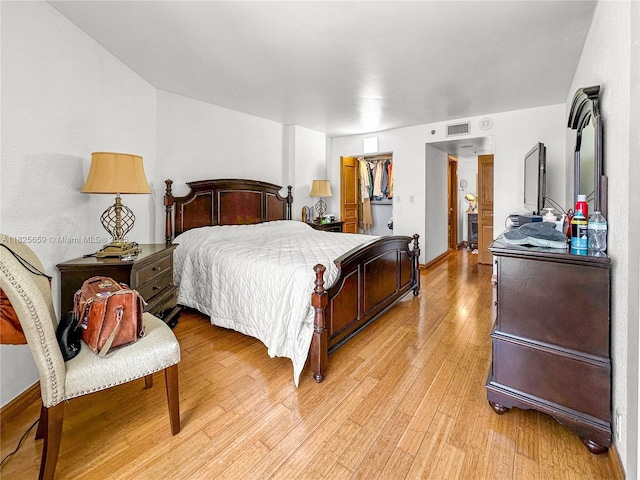 6767 Collins Ave Unit 704, Miami Beach, FL 33141 - bedroom featuring light wood-style flooring