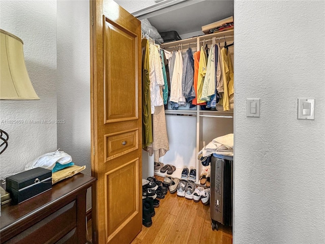 6767 Collins Ave Unit 704, Miami Beach, FL 33141 - walk in closet with wood finished floors