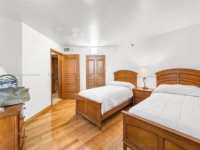 6767 Collins Ave Unit 704, Miami Beach, FL 33141 - bedroom with light wood-style flooring and baseboards