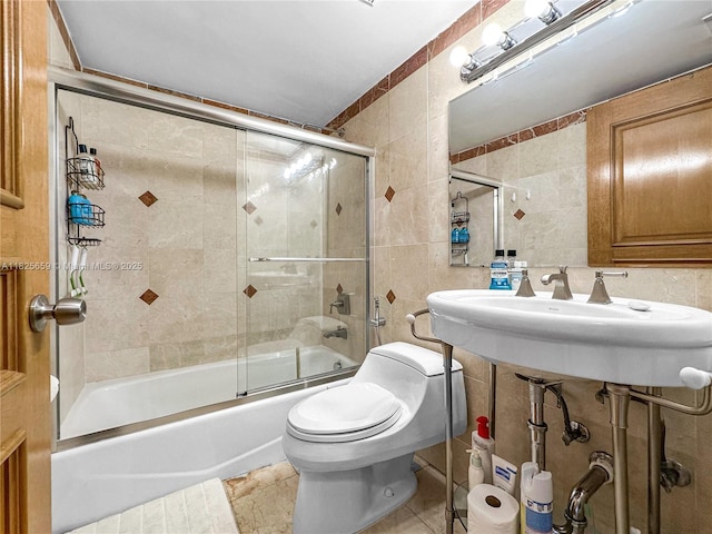 6767 Collins Ave Unit 704, Miami Beach, FL 33141 - bathroom featuring tile walls and enclosed tub / shower combo