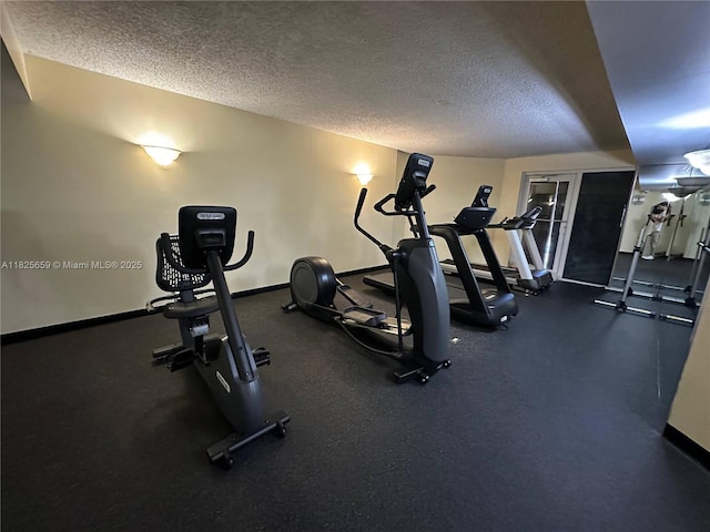 6767 Collins Ave Unit 704, Miami Beach, FL 33141 - gym with a textured ceiling and baseboards