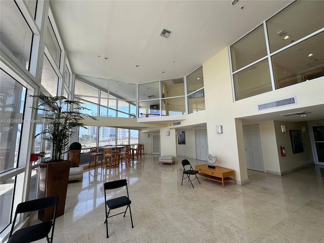 6767 Collins Ave Unit 704, Miami Beach, FL 33141 - building lobby featuring a towering ceiling