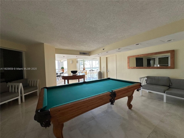 6767 Collins Ave Unit 704, Miami Beach, FL 33141 - game room featuring pool table and a textured ceiling