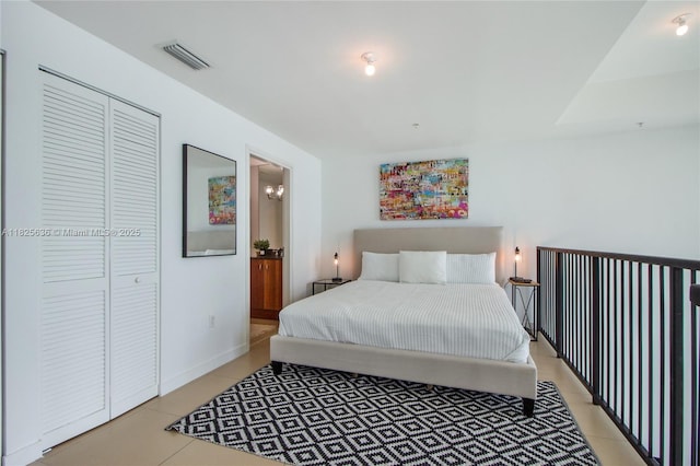300 S Biscayne Blvd Unit L-1228, Miami, FL 33131 - bedroom with light tile patterned floors and a closet