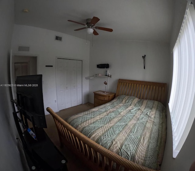 985 NE 34th Ave Unit 203, Homestead, FL 33033 - bedroom featuring multiple windows, a closet, and a ceiling fan