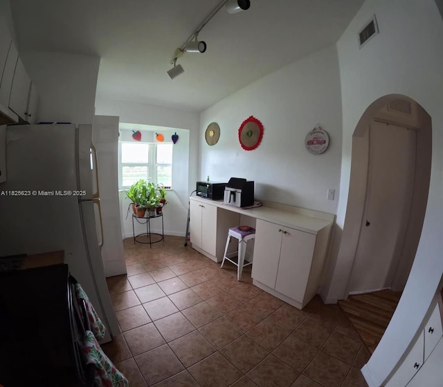 985 NE 34th Ave Unit 203, Homestead, FL 33033 - office space featuring tile patterned floors and arched walkways