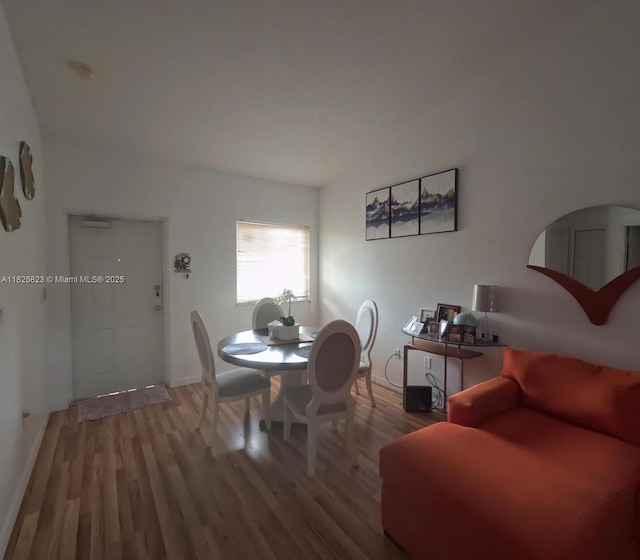 985 NE 34th Ave Unit 203, Homestead, FL 33033 - dining space featuring wood finished floors and baseboards