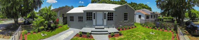1051 NW 63rd St, Miami, FL 33150 - view of front of house with stucco siding