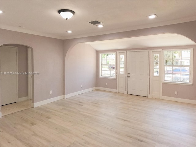 1051 NW 63rd St, Miami, FL 33150 - entrance foyer featuring arched walkways, light wood-style flooring, and recessed lighting