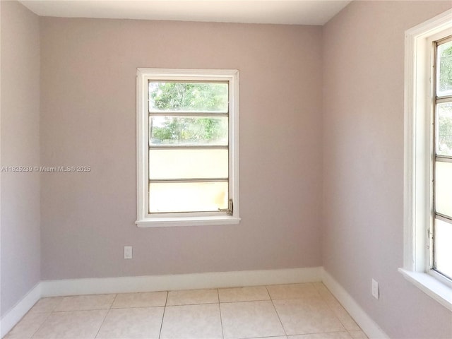 1051 NW 63rd St, Miami, FL 33150 - tiled spare room featuring healthy amount of natural light