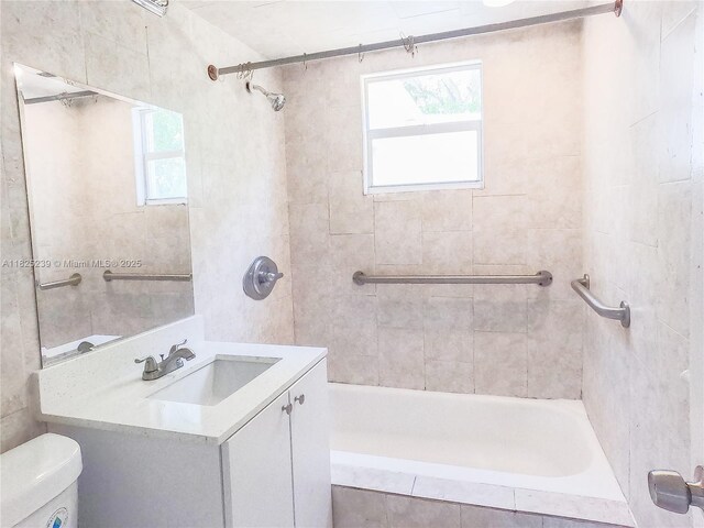 1051 NW 63rd St, Miami, FL 33150 - bathroom featuring healthy amount of natural light, vanity, and tiled shower / bath combo