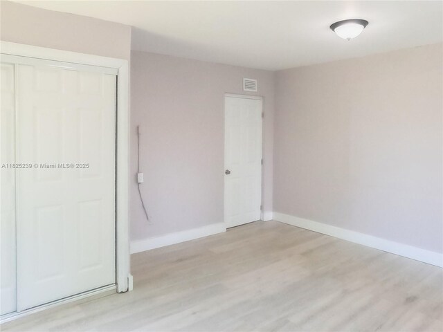 1051 NW 63rd St, Miami, FL 33150 - spare room featuring light wood-style flooring and baseboards